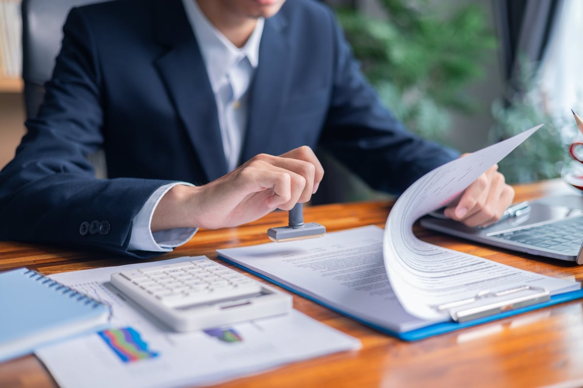 helmkaper adviser reviewing finance agreements with a client