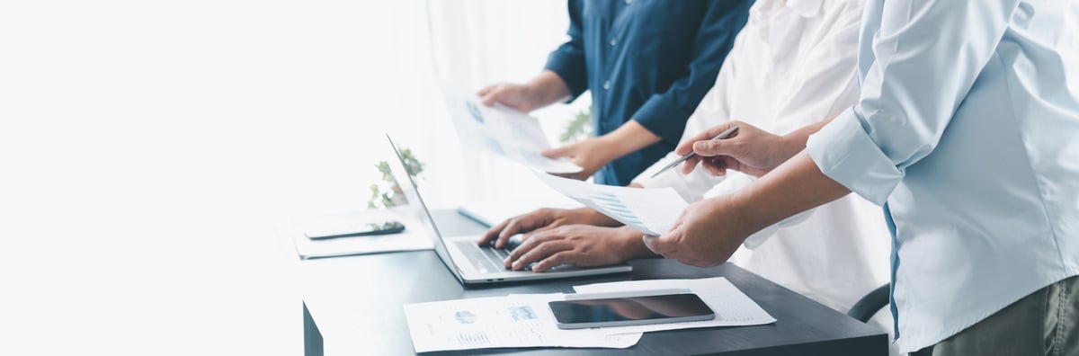 helmkaper advisors collaborating with a client over a laptop